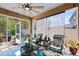 Inviting sunroom featuring cozy seating, natural light, and screened windows at 34626 Salerno Cir, Sorrento, FL 32776