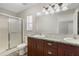 Bathroom featuring a double sink, vanity, and shower at 36 Se Almond Dr, Ocala, FL 34472