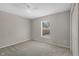 Cozy bedroom featuring neutral walls, carpet flooring, and a window at 36 Se Almond Dr, Ocala, FL 34472