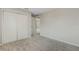 Bedroom featuring neutral walls, carpet flooring, and a closet at 36 Se Almond Dr, Ocala, FL 34472