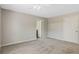 Bedroom featuring neutral walls, carpet flooring, and an ensuite bathroom at 36 Se Almond Dr, Ocala, FL 34472