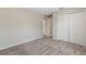 Bedroom featuring neutral walls, carpet flooring, and a closet at 36 Se Almond Dr, Ocala, FL 34472