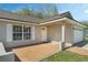Inviting front porch with brick paving, offering a welcoming entrance to the home at 36 Se Almond Dr, Ocala, FL 34472