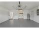 Spacious garage featuring painted floors and walls, and access to home at 36 Se Almond Dr, Ocala, FL 34472
