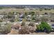 Expansive aerial view of a neighborhood with well-maintained homes, green lawns, and mature trees at 37149 Sandy Ln, Grand Island, FL 32735