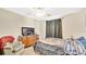 Spacious bedroom features neutral walls, large window, and ceiling fan at 37149 Sandy Ln, Grand Island, FL 32735