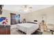 Bright bedroom features a ceiling fan, window, and neutral color palette at 37149 Sandy Ln, Grand Island, FL 32735