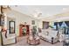 Spacious living room featuring comfortable seating, a ceiling fan, and ample natural light at 37149 Sandy Ln, Grand Island, FL 32735