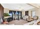 Inviting living room featuring neutral tones, large windows, and comfortable seating arrangements at 37149 Sandy Ln, Grand Island, FL 32735
