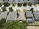 Aerial view of neighborhood homes showcasing well-maintained lawns and mature trees at 3823 Ryegrass St, Clermont, FL 34714