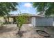 Home backyard featuring storage shed and landscaping at 3823 Ryegrass St, Clermont, FL 34714