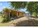 Home backyard featuring a storage shed, landscaping, and outdoor living space at 3823 Ryegrass St, Clermont, FL 34714