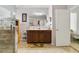 Bathroom featuring double sink vanity, tile floors, and walk-in shower at 3823 Ryegrass St, Clermont, FL 34714