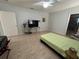 Bedroom showcasing tile flooring and an ensuite bathroom at 3823 Ryegrass St, Clermont, FL 34714