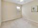Bedroom with carpeted flooring, window, and neutral tones at 3823 Ryegrass St, Clermont, FL 34714