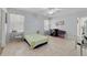 Large bedroom with tile flooring, neutral walls, and ample natural light at 3823 Ryegrass St, Clermont, FL 34714