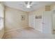 Bedroom featuring carpeted floors, window, and closet space at 3823 Ryegrass St, Clermont, FL 34714