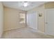 Comfortable carpeted bedroom with window and closet space at 3823 Ryegrass St, Clermont, FL 34714