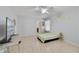 Spacious bedroom featuring tile flooring, ceiling fan, and natural light at 3823 Ryegrass St, Clermont, FL 34714