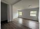 Bright bedroom with modern floors, neutral walls, and dual windows offering natural light at 3931 Avenue R Nw, Winter Haven, FL 33881