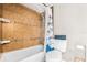Tiled shower/bath combo with tiled walls and updated fixtures at 415 Flagler Rd, Winter Haven, FL 33884