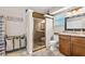 The bathroom features a walk-in shower, a vanity with a sink, and a toilet at 415 Flagler Rd, Winter Haven, FL 33884
