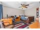 Cozy bedroom featuring wooden bed frame, decorative rug, and desk/office area at 415 Flagler Rd, Winter Haven, FL 33884