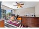 Bedroom with colorful rug, desk, bed, and a lot of natural light at 415 Flagler Rd, Winter Haven, FL 33884