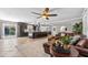 Inviting living area offering an open layout connecting to the kitchen and an inviting leather sectional at 415 Flagler Rd, Winter Haven, FL 33884