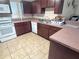 Spacious kitchen with functional layout, countertop seating, and white appliances at 4220 Solomon Dr, Orlando, FL 32811