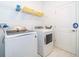 The clean laundry room offers the convenience of modern appliances and storage with a tile floor at 4338 Rhyme St, Kissimmee, FL 34746
