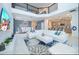 Bright open-concept living space featuring high ceilings, tile flooring, and a modern chandelier at 4338 Rhyme St, Kissimmee, FL 34746