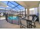 Enjoy this screened-in patio with a dining area, perfect for outdoor gatherings and overlooking the pool at 4338 Rhyme St, Kissimmee, FL 34746