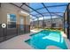 Relax in the screened-in pool and spa area, an ideal outdoor space with a private backyard oasis at 4338 Rhyme St, Kissimmee, FL 34746