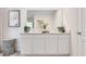 Bright bathroom showcasing double sinks, a large mirror, ample countertop space, and modern decor at 4649 Barberry Ave, Lakeland, FL 33811