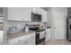 Modern kitchen with stainless steel appliances, sleek countertops, and ample storage space at 483 Taylor Groves Dr, Lake Wales, FL 33898