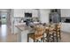 Modern kitchen featuring an island with seating, stainless steel appliances, and ample counter space at 483 Taylor Groves Dr, Lake Wales, FL 33898