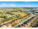 Overhead view of homes in a community, showcasing the layout and proximity to surrounding lakes and amenities at 5260 Oakbourne Ave, Davenport, FL 33837