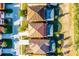 Bird's-eye view of rooftops and pools of residential homes, highlighting neighborhood layout and amenities at 5260 Oakbourne Ave, Davenport, FL 33837