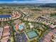 Aerial view of the community featuring pool, tennis courts, lush landscaping and beautiful homes at 5260 Oakbourne Ave, Davenport, FL 33837