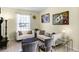 Cozy living room with comfortable seating, stylish decor, and plenty of natural light at 5260 Oakbourne Ave, Davenport, FL 33837