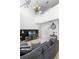 Bright living room with high ceilings, a large sofa, and a decorative chandelier creating an inviting atmosphere at 5260 Oakbourne Ave, Davenport, FL 33837