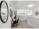 Bright loft area with a desk, chair, mirrors and natural light at 5260 Oakbourne Ave, Davenport, FL 33837