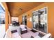 Covered lanai with plush seating, outdoor dining and views of pool at 5260 Oakbourne Ave, Davenport, FL 33837