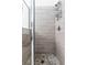 Tiled shower with glass door and stone floor at 5260 Oakbourne Ave, Davenport, FL 33837