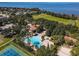 Community pool and sports facilities, including tennis and volleyball, enhance lifestyle at 604 Fortanini Cir, Ocoee, FL 34761