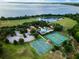 Aerial view of community pool, park, tennis, and basketball courts and lake access at 604 Fortanini Cir, Ocoee, FL 34761