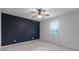 This bedroom features a ceiling fan and a modern accent wall at 604 Fortanini Cir, Ocoee, FL 34761
