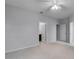 This carpeted bedroom features an ensuite bath and closet at 604 Fortanini Cir, Ocoee, FL 34761