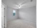 Bedroom with a bright window and a ceiling fan at 604 Fortanini Cir, Ocoee, FL 34761